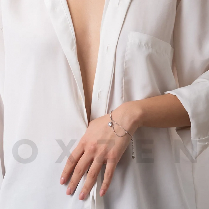 Βραχιόλι ριβιέρα ατσάλινη με ένα μεγάλο λευκό ζιργκόν